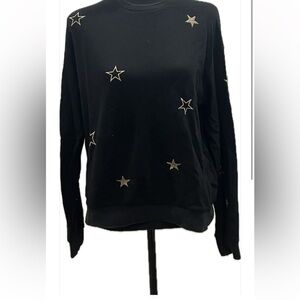 Black sweater with gold stars